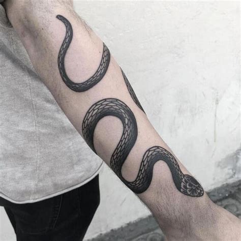 snake tattoo around the arm